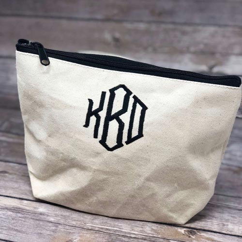 Beige canvas bag with a monogram